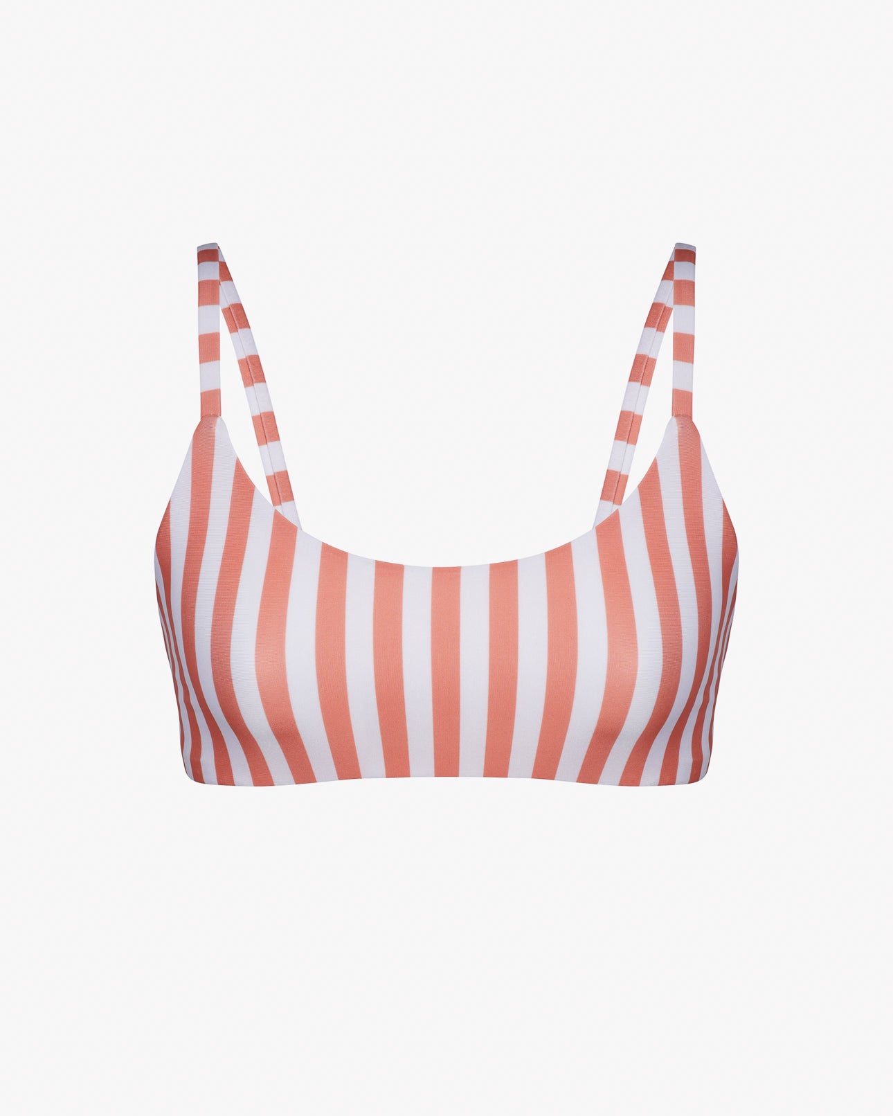 Das Sassy Bikini Oberteil von Main Design ist ein wendbares, gestreiftes Bikinioberteil mit dünnen Trägern aus chlorresistentem Stoff. Es besticht durch vertikale rosa und weiße Streifen, die Nachhaltigkeit und Stil vereinen, während seine Schlichtheit das klassische Streifenmuster unterstreicht.