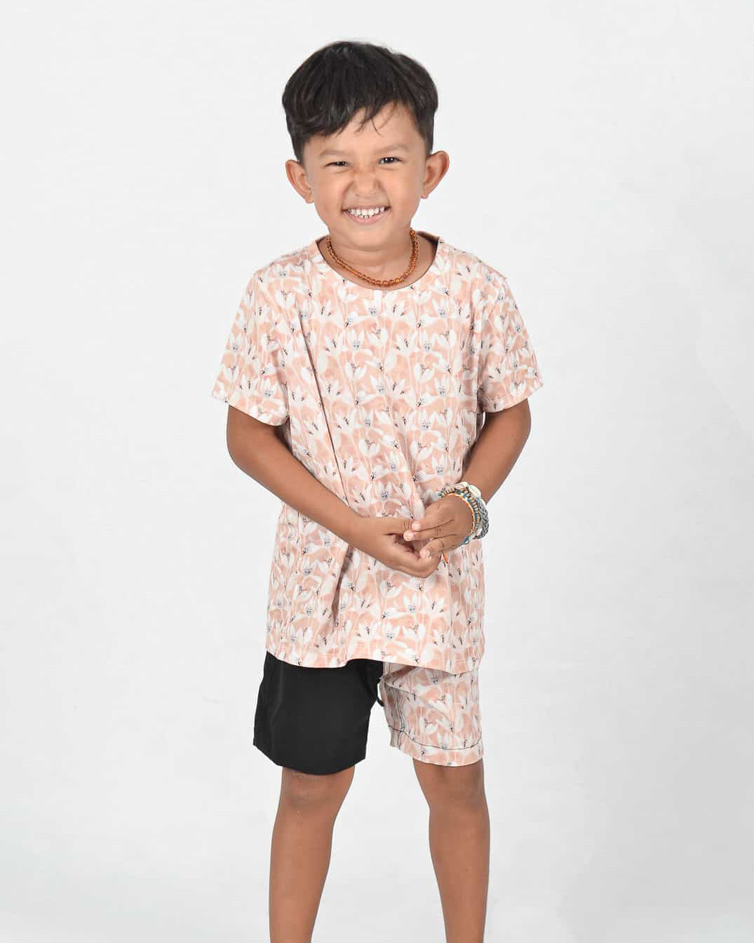 Aina Kids UV shirt in flowers and Lean Boy Boardshorts in black flowers
