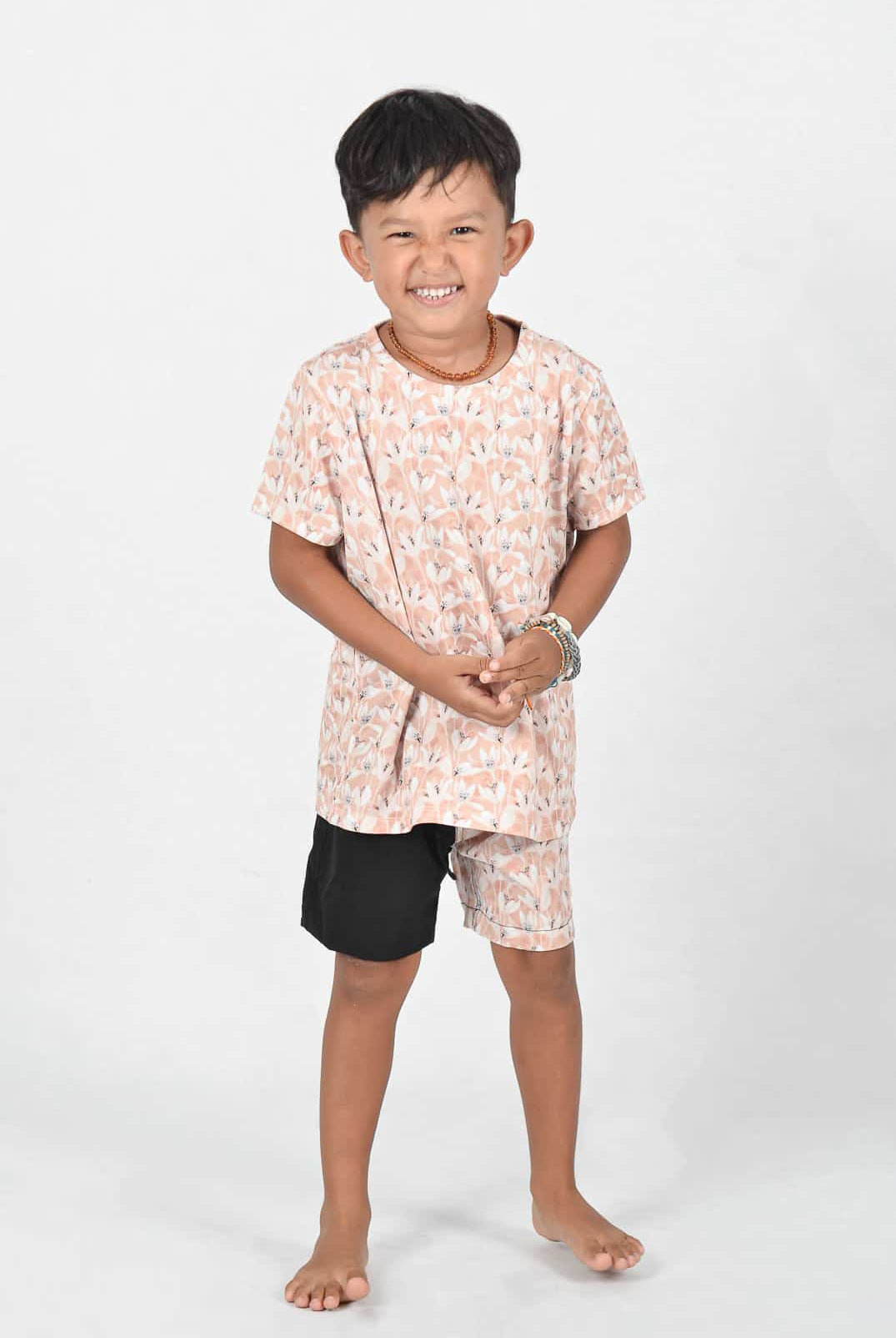 Aina Kids UV shirt in flowers and Lean Boy Boardshorts in black flowers