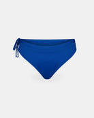 Die Main Design Tide Surf Bikini Hose hat eine blaue Farbe, einen verstellbaren Kordelzug im Bund und ein seitliches Bindeband auf der linken Seite, abgebildet auf einem schlichten weißen Hintergrund.