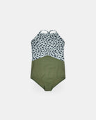 Der Lena Mädchen Badeanzug von Main Design ist nachhaltig, hat Halterneck, hellblaues Oberteil mit schwarzen Punkten, olivgrünes Unterteil und dünne, gekreuzte Rückenriemen für einen modernen Look.