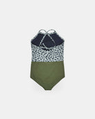 Der Lena Mädchen Badeanzug von Main Design: Ein nachhaltiger Einteiler mit navy-weiß gepunktetem Oberteil, crisscross Rücken-Trägern und olivgrünem Unterteil aus recycelten Materialien - vor weißem Hintergrund.