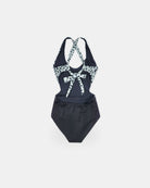 Der Milly Mädchen Badeanzug von Main Design ist ein schwarzer Badeanzug mit weissen und schwarzen Leoparden-Print-Trägern und einem Schleifendetail, perfekt für die stylische Kinderbademode Schweiz, abgebildet auf einem einfarbig weissen Hintergrund.