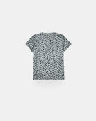 Das Main Design Aina Kinder UV Shirt ist ein kurzärmeliges, hellgraues Shirt mit schwarzen Punkten aus nachhaltigem Material. Es bietet UPF 50+ Sonnenschutz und ist flach vor einem weißen Hintergrund abgebildet, um die Vorderseite zu zeigen.