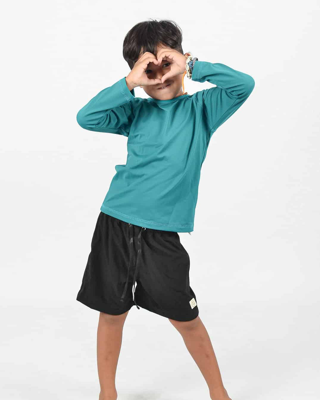 Marlon Rashguard in deep sea and Lean Boy Boardshorts