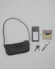 BAGGU Recycled Leather Pochette: Offizielles BAGGU-Modellvideo zeigt das Packen und den Stauraum. all-groups